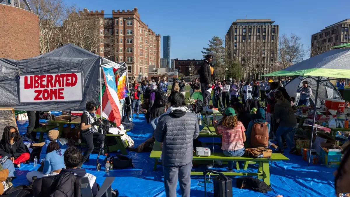 Diverse group of activists and community members gathered at a Liberated Zone outdoor encampment promoting diverse civic harmony