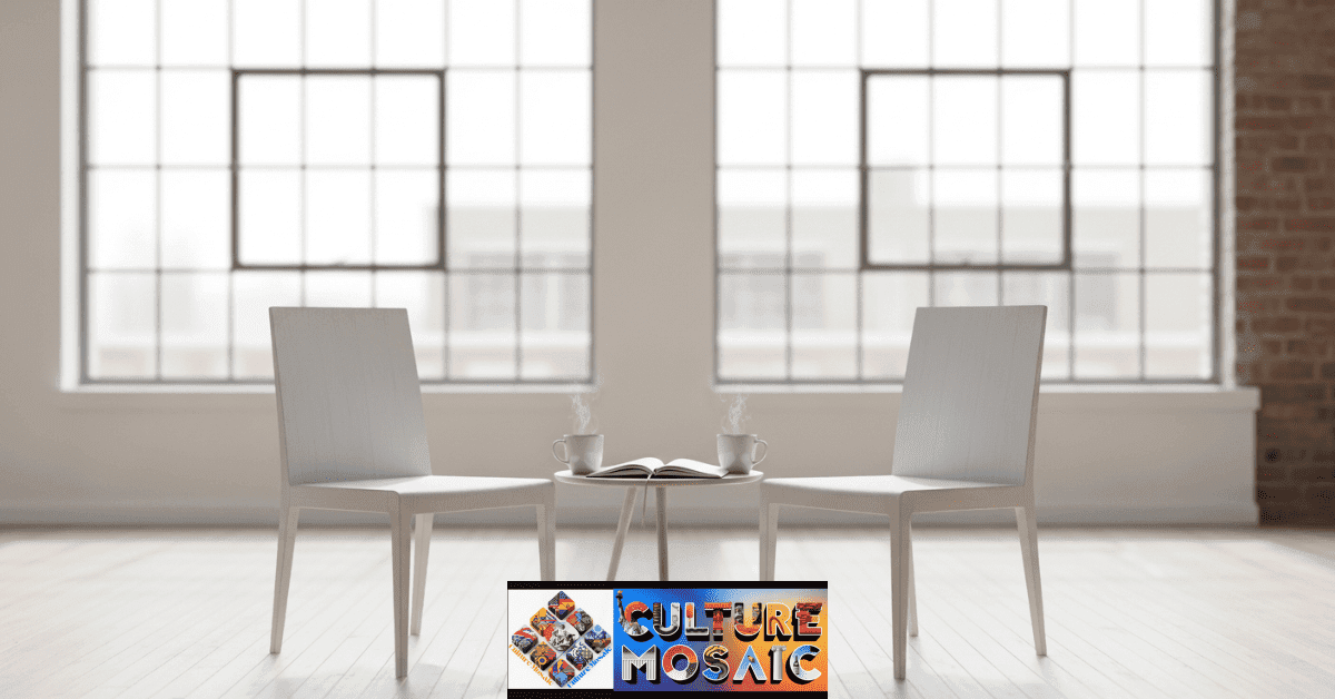 Two chairs and a notebook in a sunlit room, symbolizing a safe space for active listening and civic dialogue.