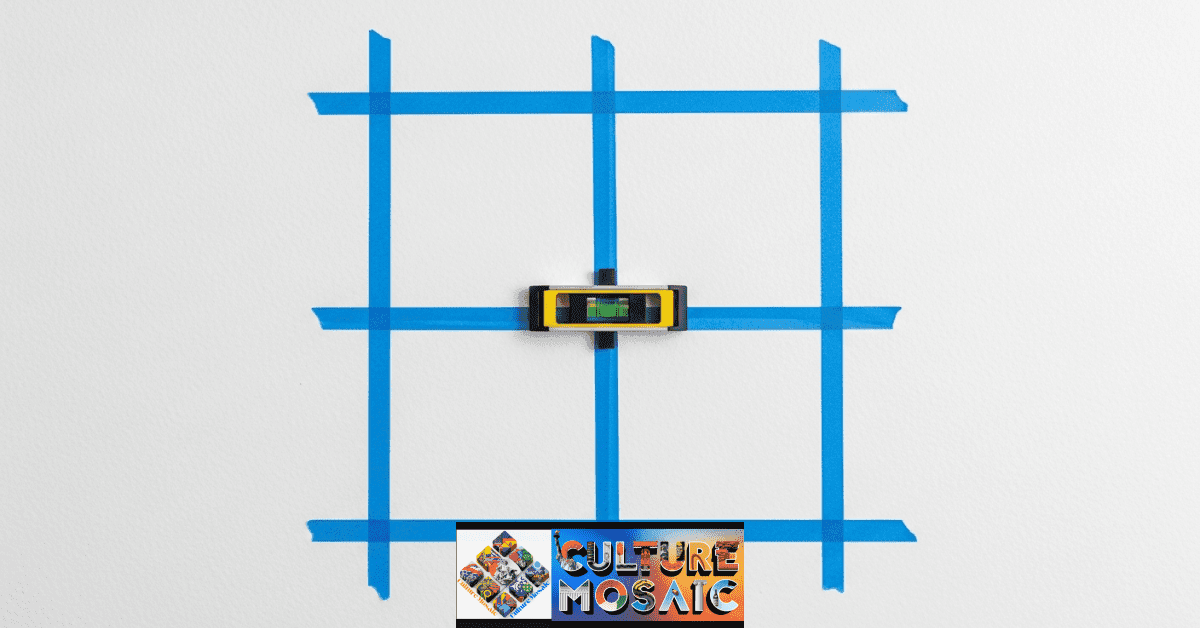 Applying a linear grid pattern to a wall using painter's tape and a bubble level.