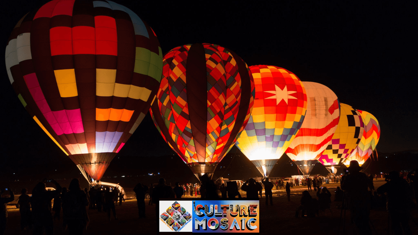 Vibrant hot air balloons glowing against the night sky during the pre-dawn Glow Show at the Great Reno Balloon Race as spectators watch from below. when is the great reno balloon race?